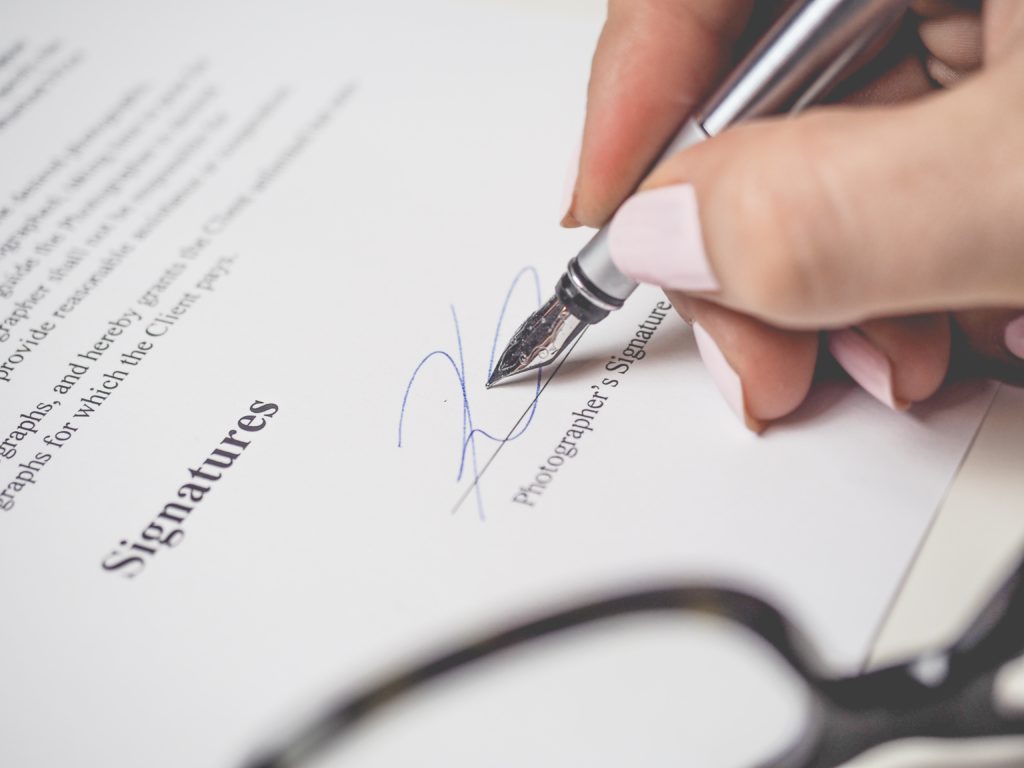 Landlord signing a tenancy agreement.